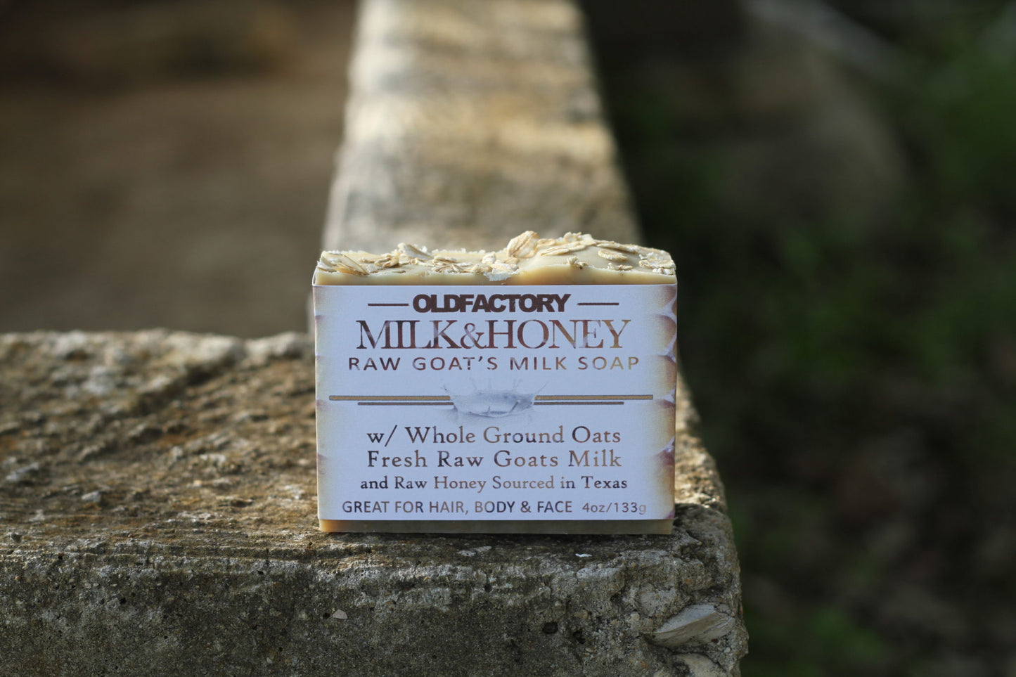 the healthy promise soap handcrafted all natural goats milk and honey front view on a stone wall