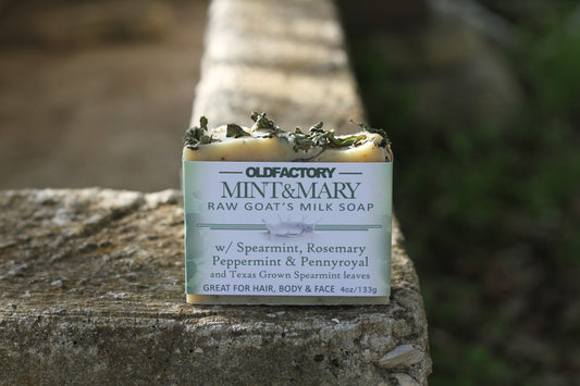 the healthy promise soap handcrafted goats milk mint and mary front of bar on a stone wall